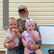 Kasey is registered to the contest to win money with this photo: baby, baby_toddler_clothing, baseball_cap, cap, child, clothing, door, event, face, fun, gesture, happy, hat, leisure, pink, recreation, sitting, sun_hat, toddler, vacation