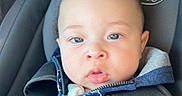 Zyaire joined the competition — help win amazing prizes! baby, baby_boy, blue_eyes, car_interior, car_seat, child, closeup, clothing, curly_hair, cute, hoodie, indoors, infant, person, portrait, safety, seat, seatbelt, straps, young_child