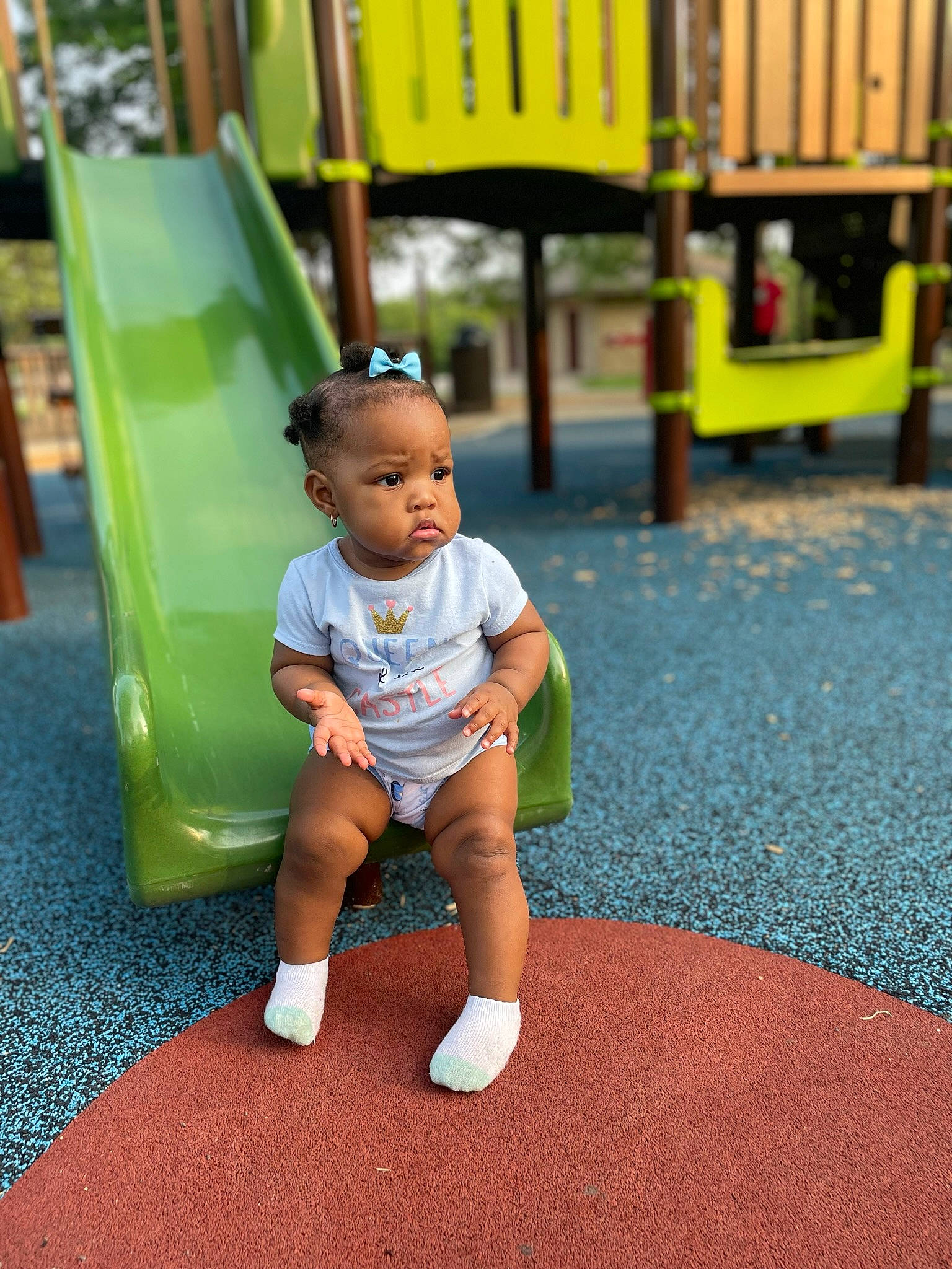 Alexandria joined the competition — help win amazing prizes! baby, baby_toddler_clothing, child, city, flooring, fun, grass, happy, human_leg, leaf, leisure, outdoor_play_equipment, person, play, playground, playground_slide, recreation, sitting, t_shirt, toddler
