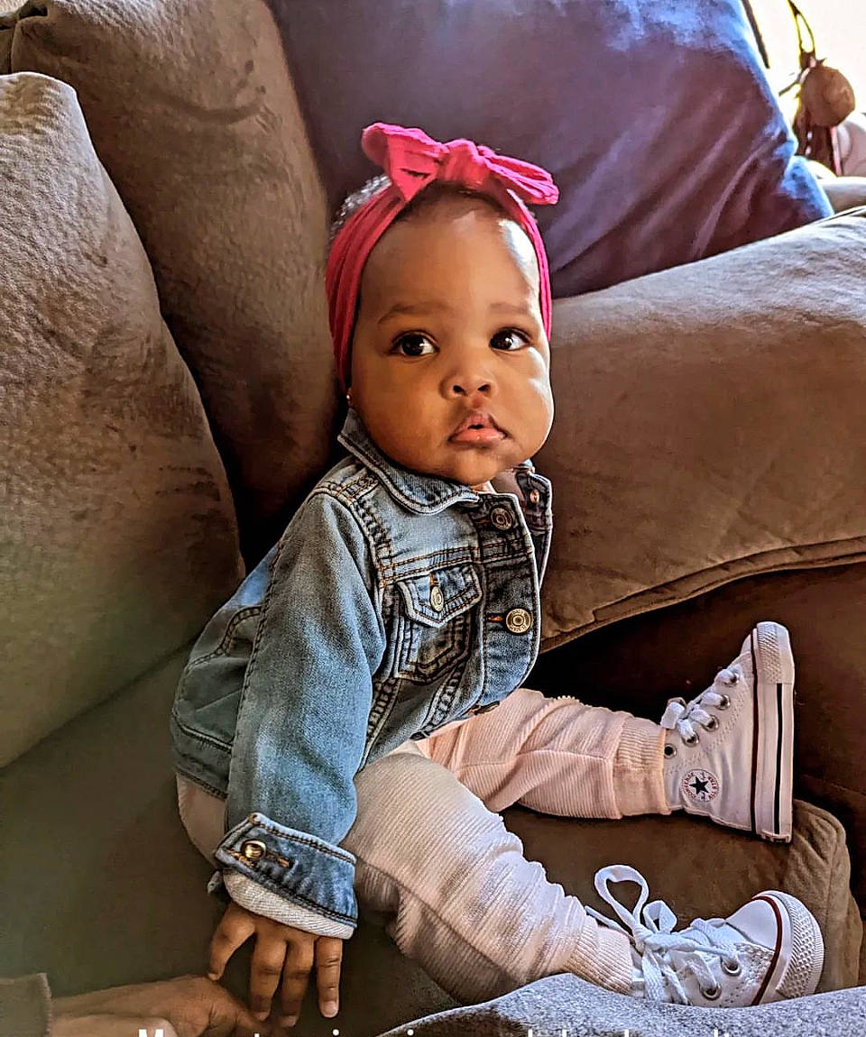 Alexandria joined the competition — help win amazing prizes! baby, baby_products, baby_toddler_clothing, cap, child, comfort, couch, fashion_accessory, fun, fur, happy, linens, person, portrait_photography, room, sitting, sleeve, textile, throw_pillow, toddler