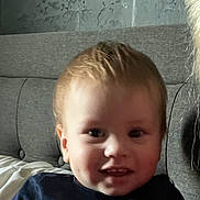 Amin joined the competition — help win amazing prizes! baby, child, infant, portrait, sitting, couch, indoors, home, face, smiling, happy, blue_shirt, blond_hair, short_hair, eyes, nose, mouth, sunlight, close_up, photography