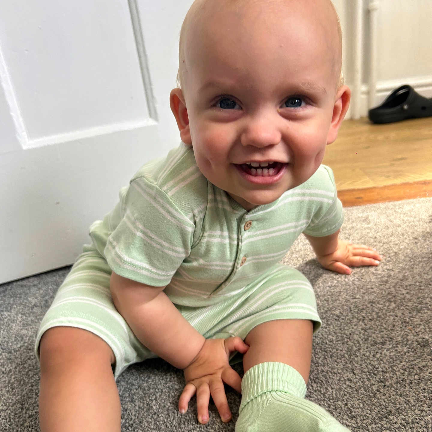 Karter is registered to the contest to win money with this photo: baby, babylaughing, clothing, crawling, face, footwear, happy, head, hosiery, laughing, pants, person, photography, portrait, shoe, sitting, smile, sock