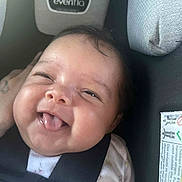 Leilani joined the competition — help win amazing prizes! baby, infant, smiling, tongue_out, car_seat, child, straps, cute, face, closeup, happy, young_child, clothing, person, seatbelt, head, expression, indoors, comfort, adorable