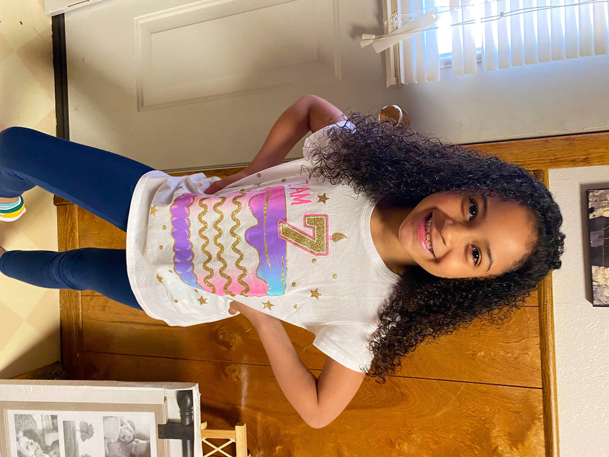 Bryleigh is registered to the contest to win money with this photo: abdomen, bangs, blurred, elbow, fashion_design, flooring, fun, happy, human_leg, joint, joy, knee, magenta, pattern, person, picture_frame, sleeve, smile, street_fashion, textile