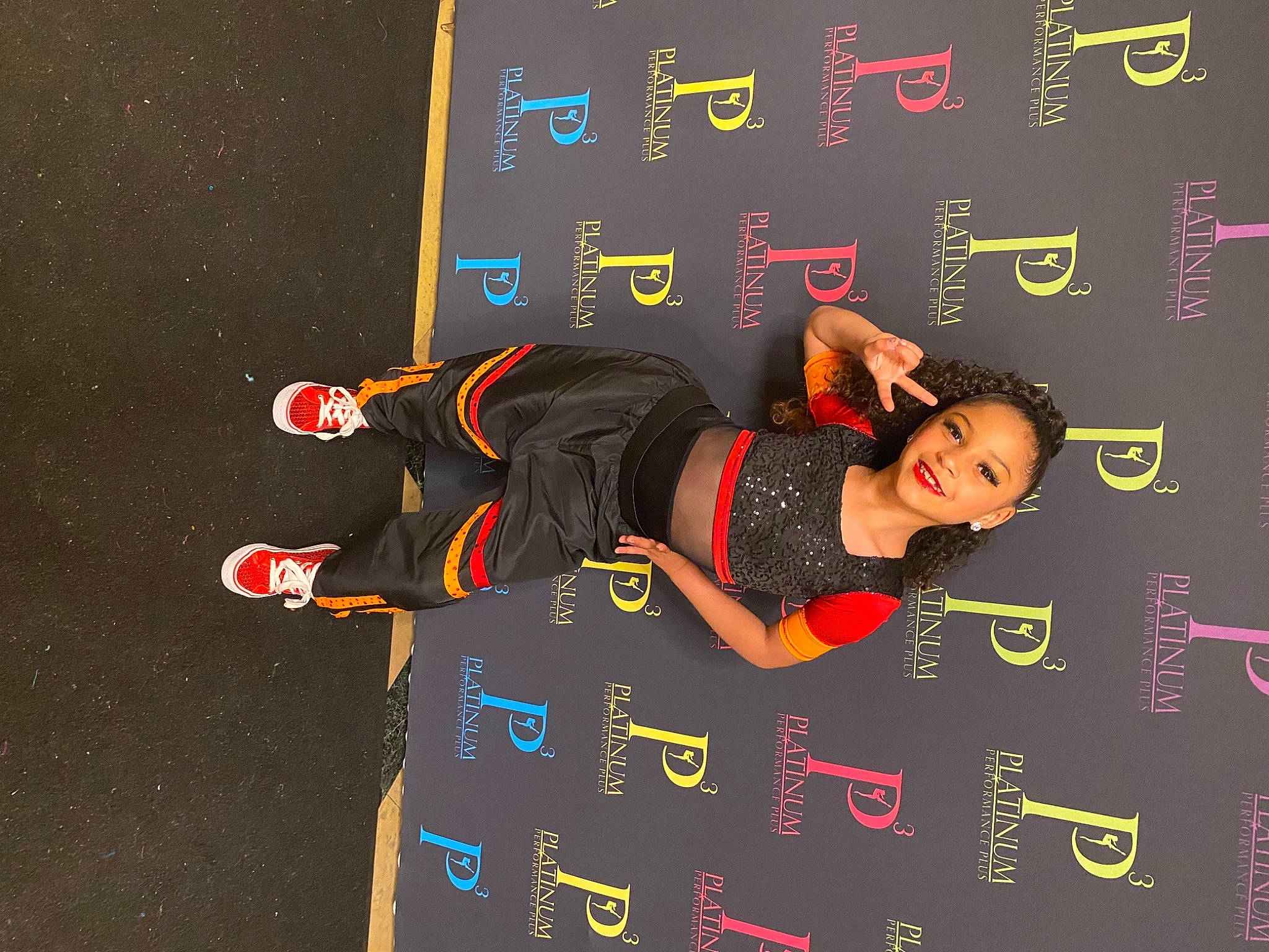 Bryleigh joined the competition — help win amazing prizes! arm, event, flash_photography, font, fun, gesture, graphics, joy, person, room, sleeve, smile, wrist