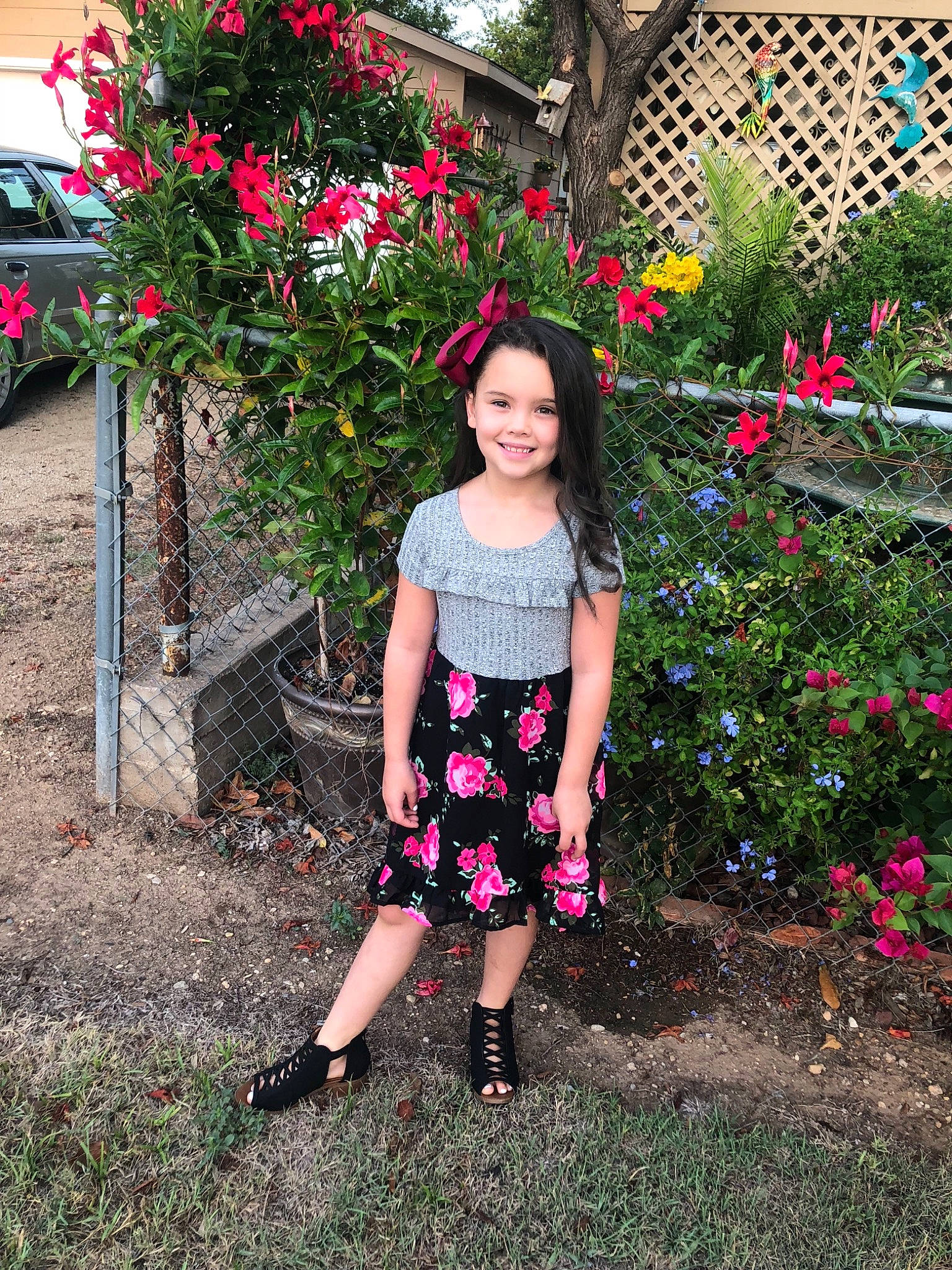 Jaelyn is registered to the contest to win money with this photo: child, clothing, day, design, dress, flower, fun, garden, girl, grass, joy, pattern, person, pink, plant, recreation, shoulder, shrub, spring, summer