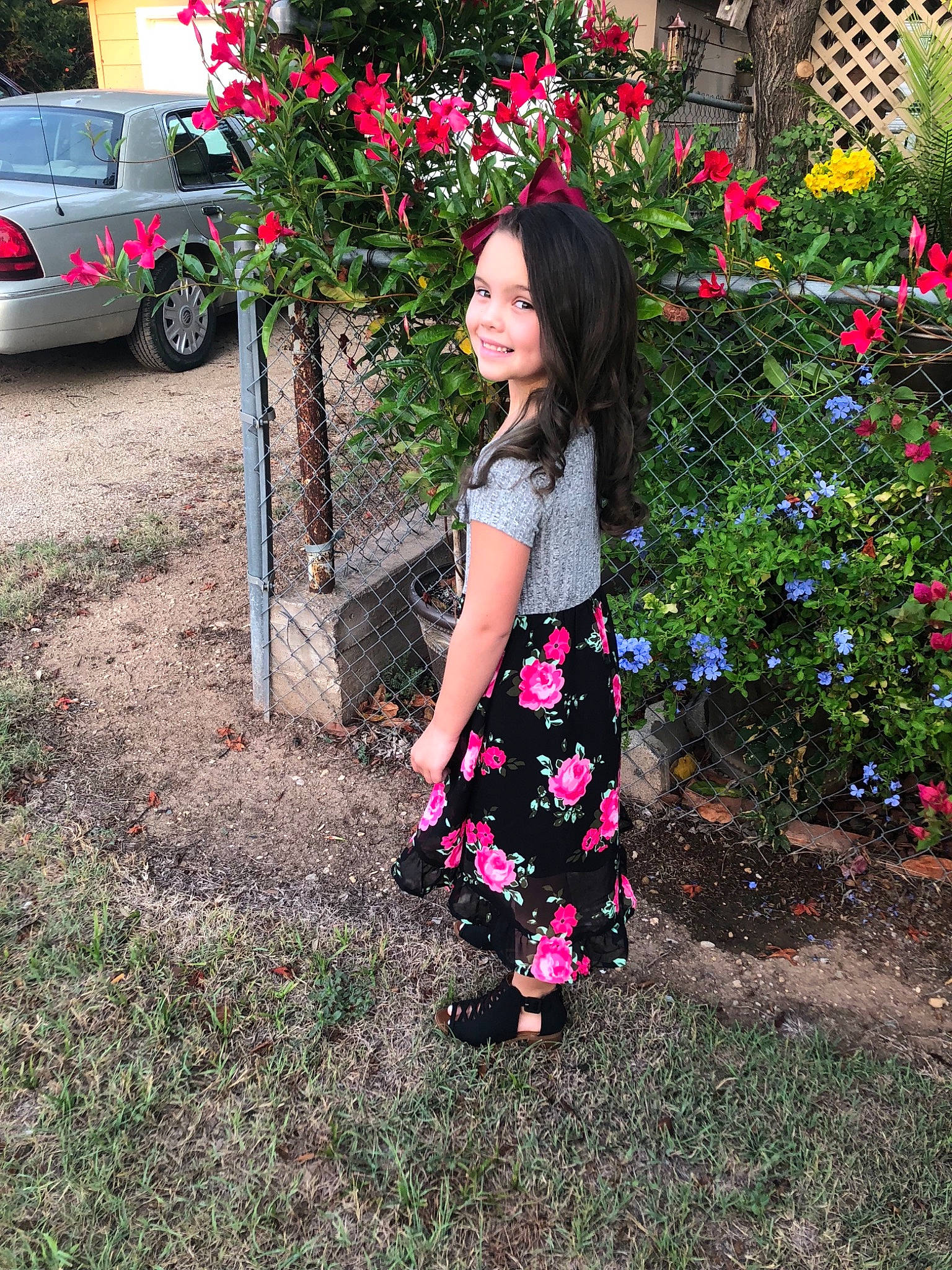 Jaelyn is registered to the contest to win money with this photo: child, clothing, day, design, dress, flora, flower, fun, garden, girl, grass, joy, pattern, person, pink, plant, shrub, spring, tree, vacation