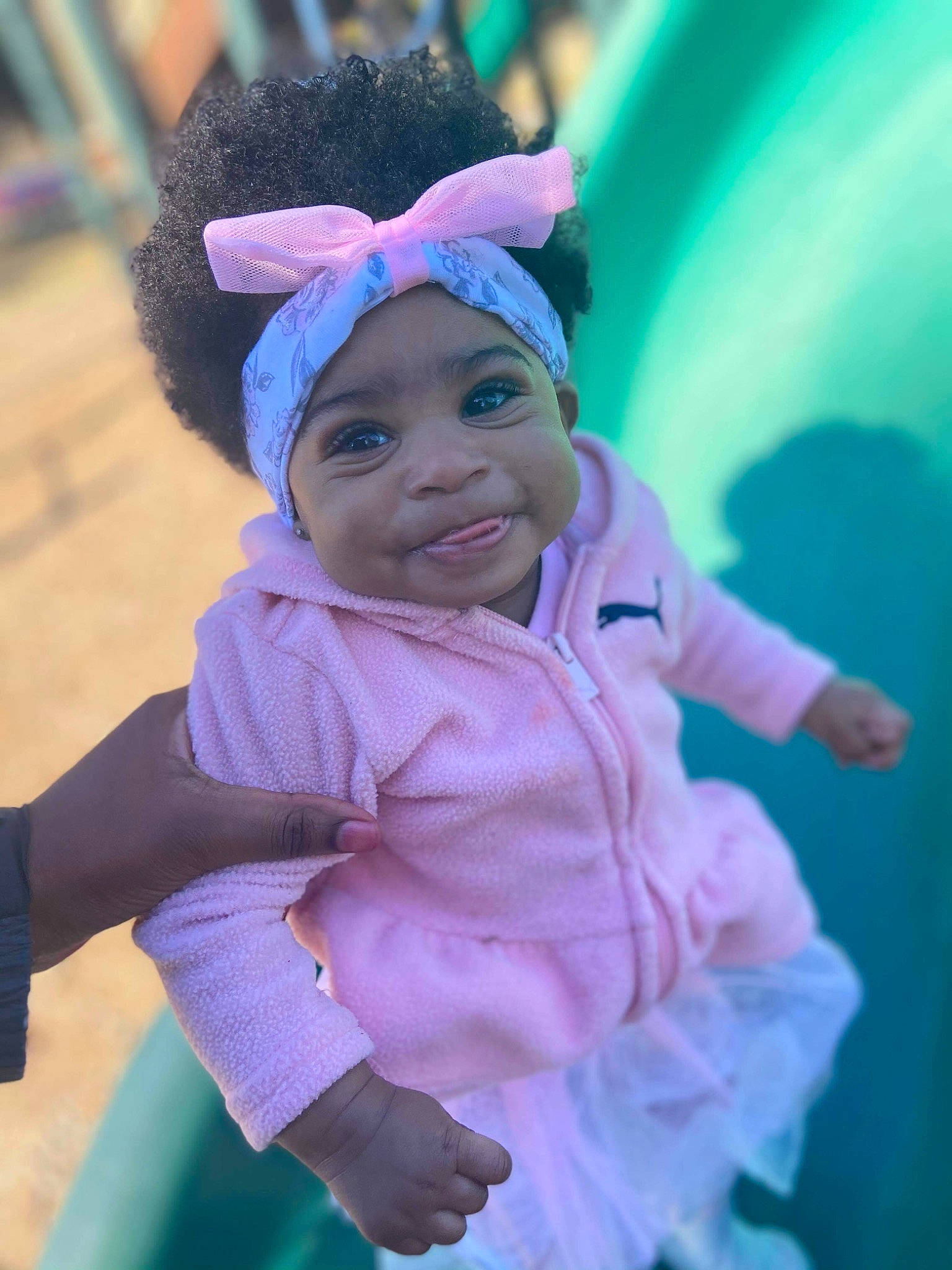 Honesty is registered to the contest to win money with this photo: baby, baby_toddler_clothing, cap, child, clothing, costume, electric_blue, fun, grass, green, happy, headwear, leisure, magenta, person, pink, purple, recreation, sleeve, smile