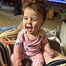 Violet joined the competition — help win amazing prizes! baby, child, laughing, pink_clothing, mickey_mouse, pajamas, indoor, living_room, blurred_background, person, happy, seated, cute, infant, smiling, short_hair, playful, family, cozy, casual