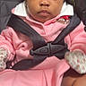baby, car_seat, child, clothing, cute, face, football_patch, head, indoors, infant, mittens, person, pink_clothing, portrait, safety_harness, seatbelt, serious_expression, sitting, socks, young_child