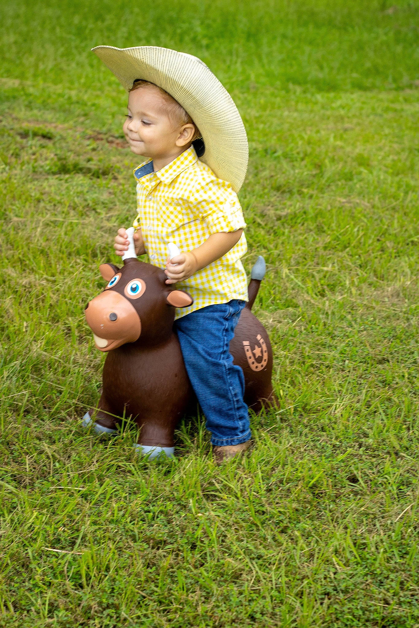 Rhett is registered to the contest to win money with this photo: baby, baby_toddler_clothing, cap, grass, grass_family, grassland, groundcover, happy, hat, jeans, landscape, lawn, leisure, meadow, people_in_nature, person, plant, prairie, recreation, sun_hat