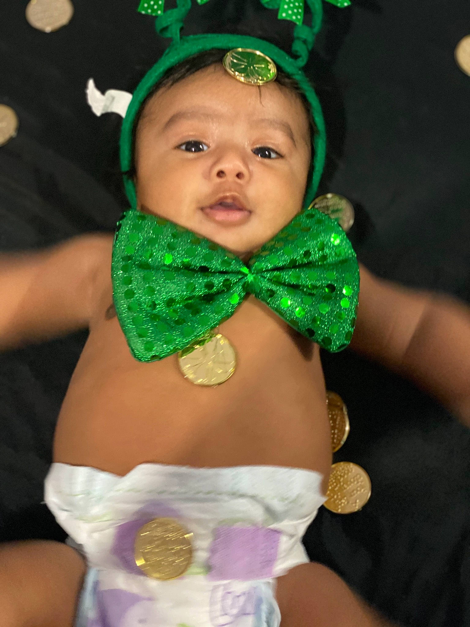 Luis is registered to the contest to win money with this photo: baby, child, costume, costume_accessory, fashion_accessory, fictional_character, green, hair_accessory, headband, headgear, neck, person, toddler