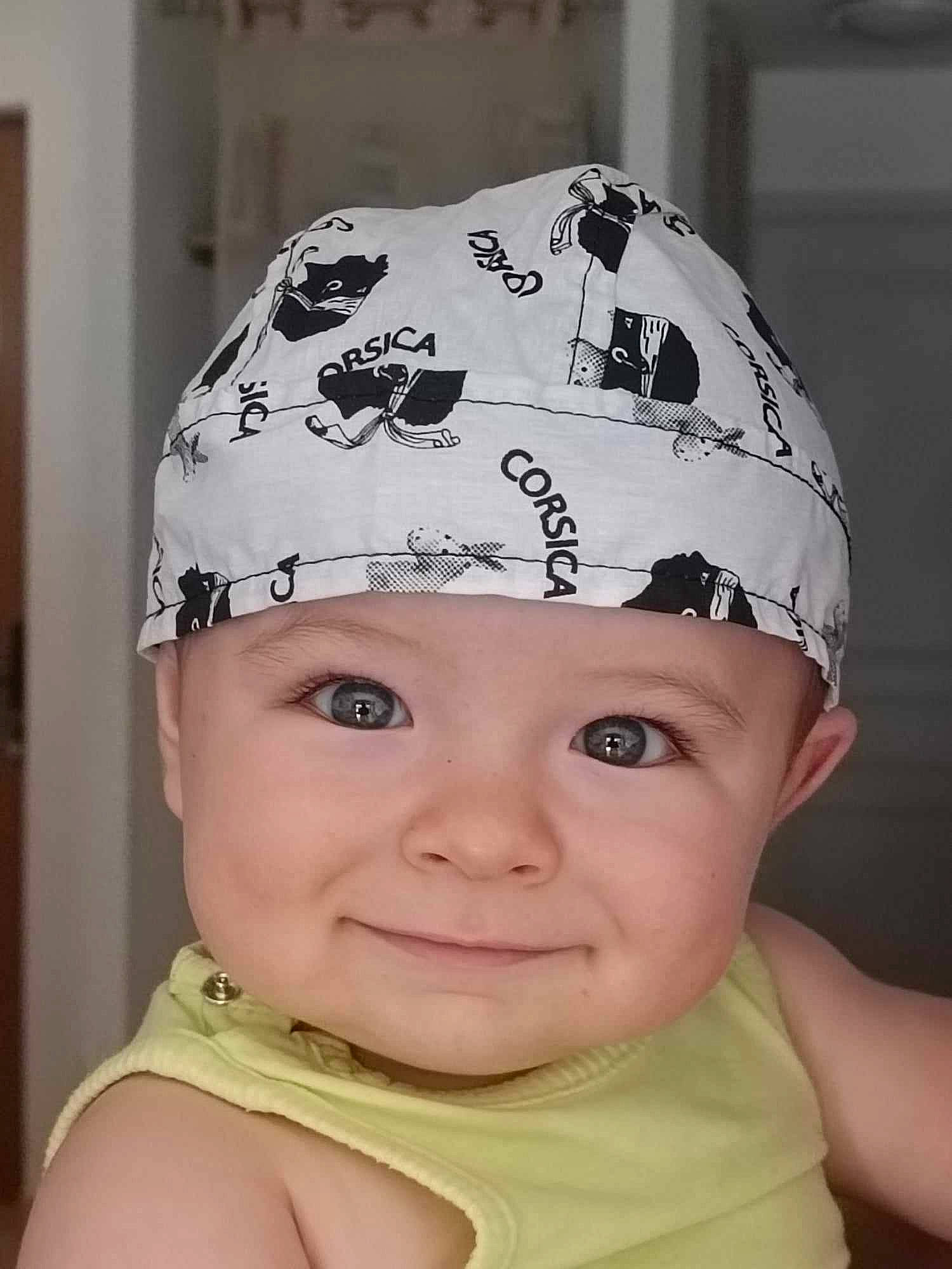Marceau participe au concours pour gagner de l'argent avec cette photo : baby, baby_toddler_clothing, beanie, cap, cheek, child, cool, costume_accessory, costume_hat, eyelash, fashion_accessory, fun, hair_accessory, happy, headgear, headwear, joy, pattern, person, portrait_photography