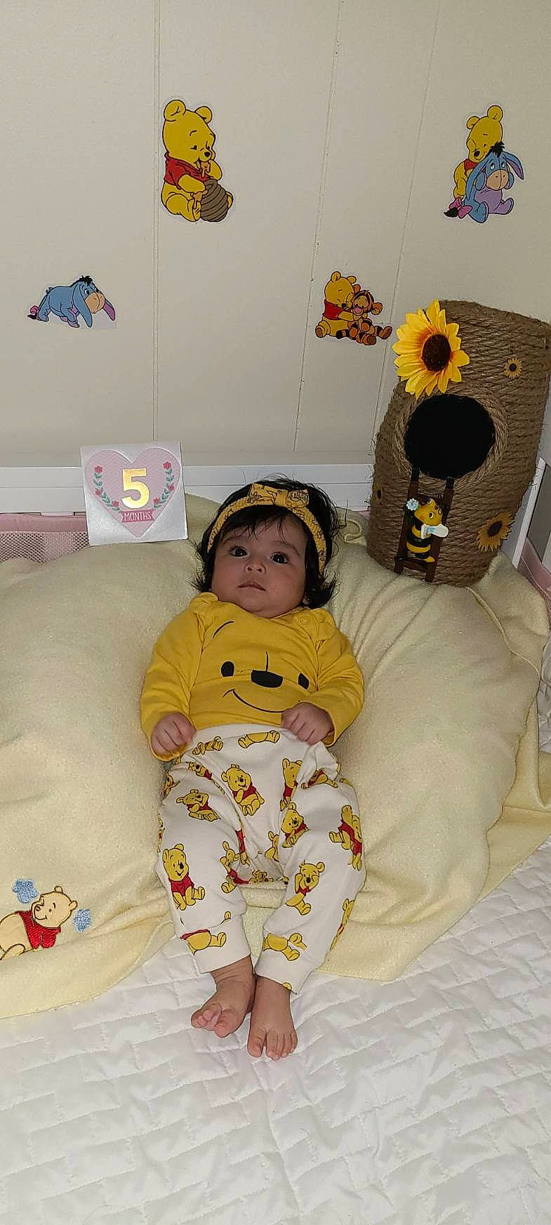 Leah is registered to the contest to win money with this photo: baby, baby_products, baby_toddler_clothing, baby_toys, child, comfort, couch, event, fun, happy, headwear, linens, person, play, product, room, sitting, sleeve, stuffed_toy, textile