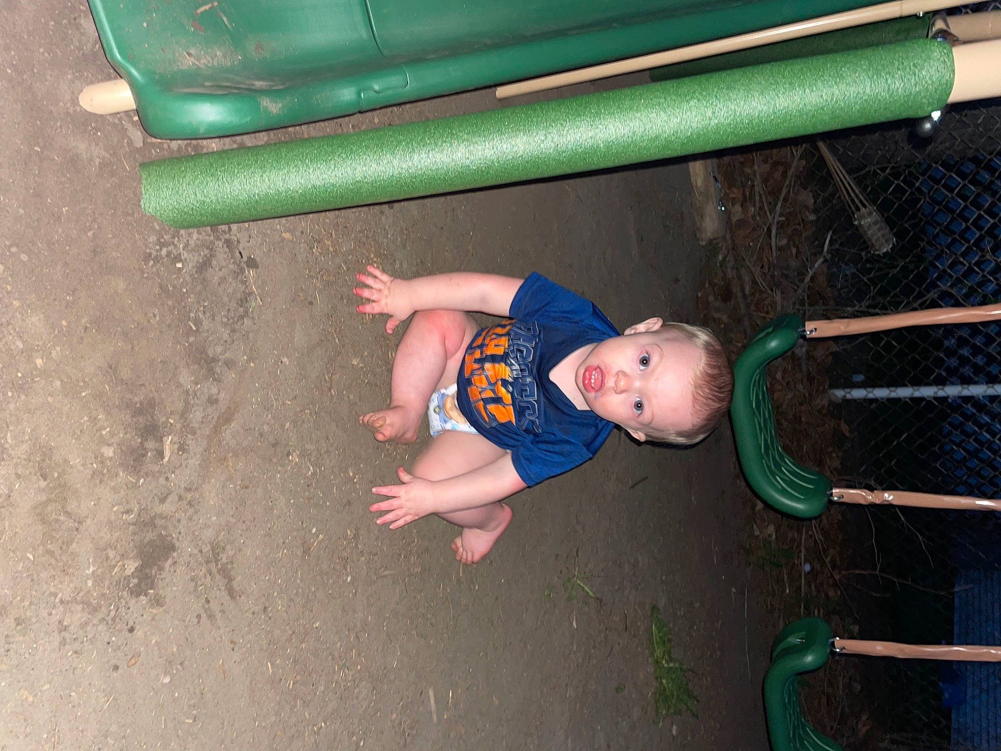 Jaisean is registered to the contest to win money with this photo: baby, baby_toddler_clothing, child, city, concrete, fun, grass, leisure, outdoor_play_equipment, person, play, playground, playground_slide, recreation, shade, sitting, soil, surprise, swing, toddler