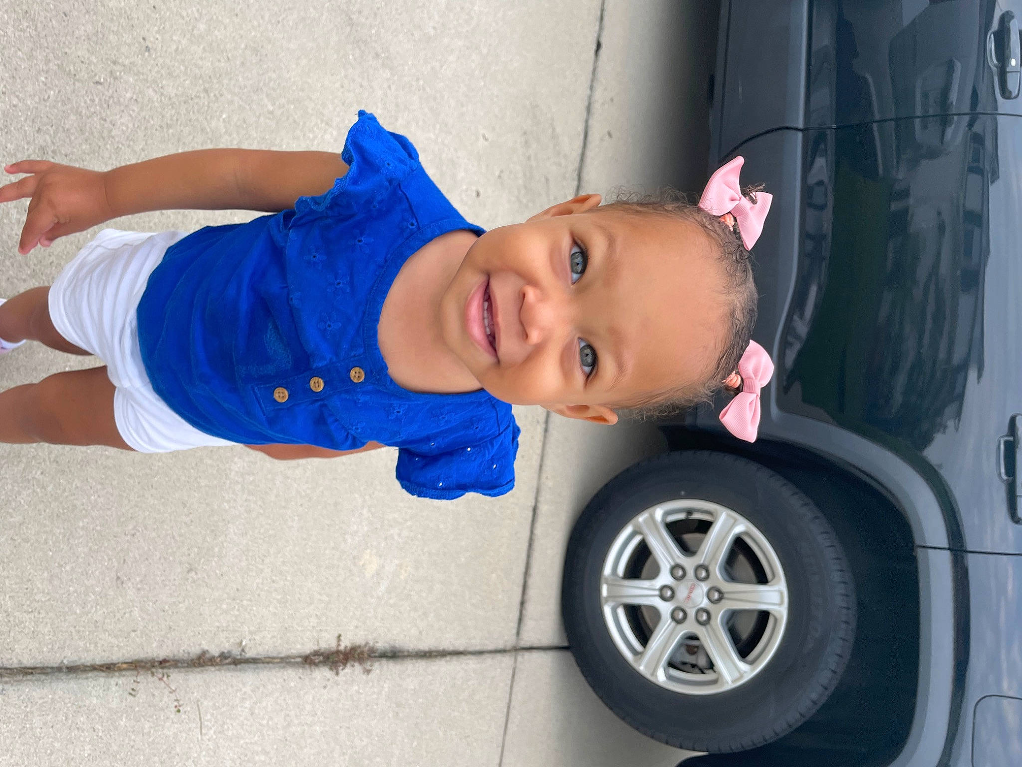 Arianna Harper is registered to the contest to win money with this photo: alloy_wheel, automotive_design, automotive_lighting, automotive_tire, baby_toddler_clothing, bumper, car, fender, hood, hubcap, motor_vehicle, person, rim, smile, synthetic_rubber, tire, toddler, tread, vehicle, vehicle_door