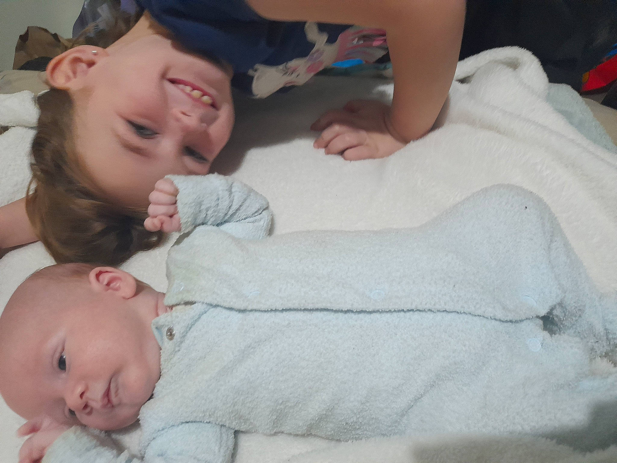 Alyssa is registered to the contest to win money with this photo: baby, baby_toddler_clothing, cheek, child, comfort, facial_expression, finger, fun, gesture, grass, hand, happy, hat, joy, mouth, muscle, nose, person, skin, sleeve