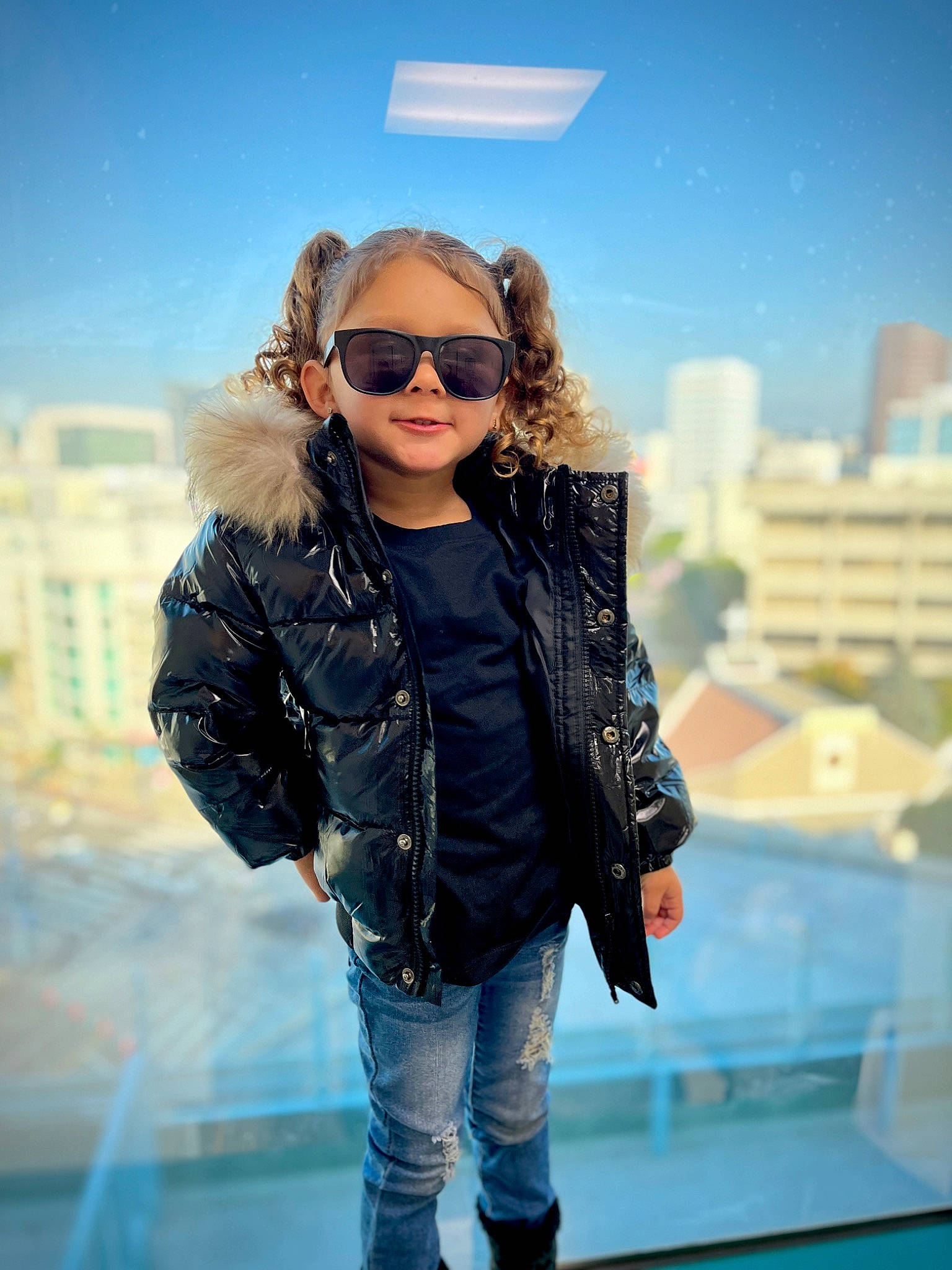 Ariella is registered to the contest to win money with this photo: azure, blond, cool, denim, electric_blue, eyewear, fashion_design, flash_photography, fun, goggles, happy, jacket, joy, leisure, person, sky, sleeve, standing, sunglasses, travel