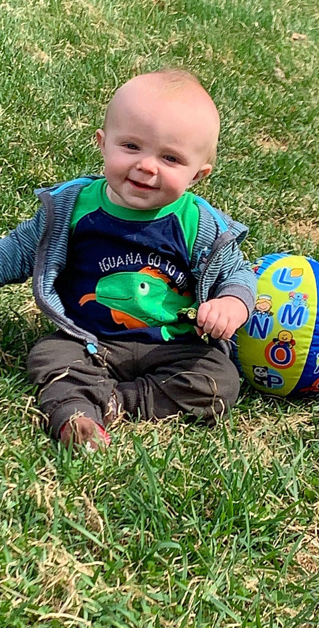 Jace is registered to the contest to win money with this photo: baby, child, grass, joy, lawn, person, play, sitting, toddler