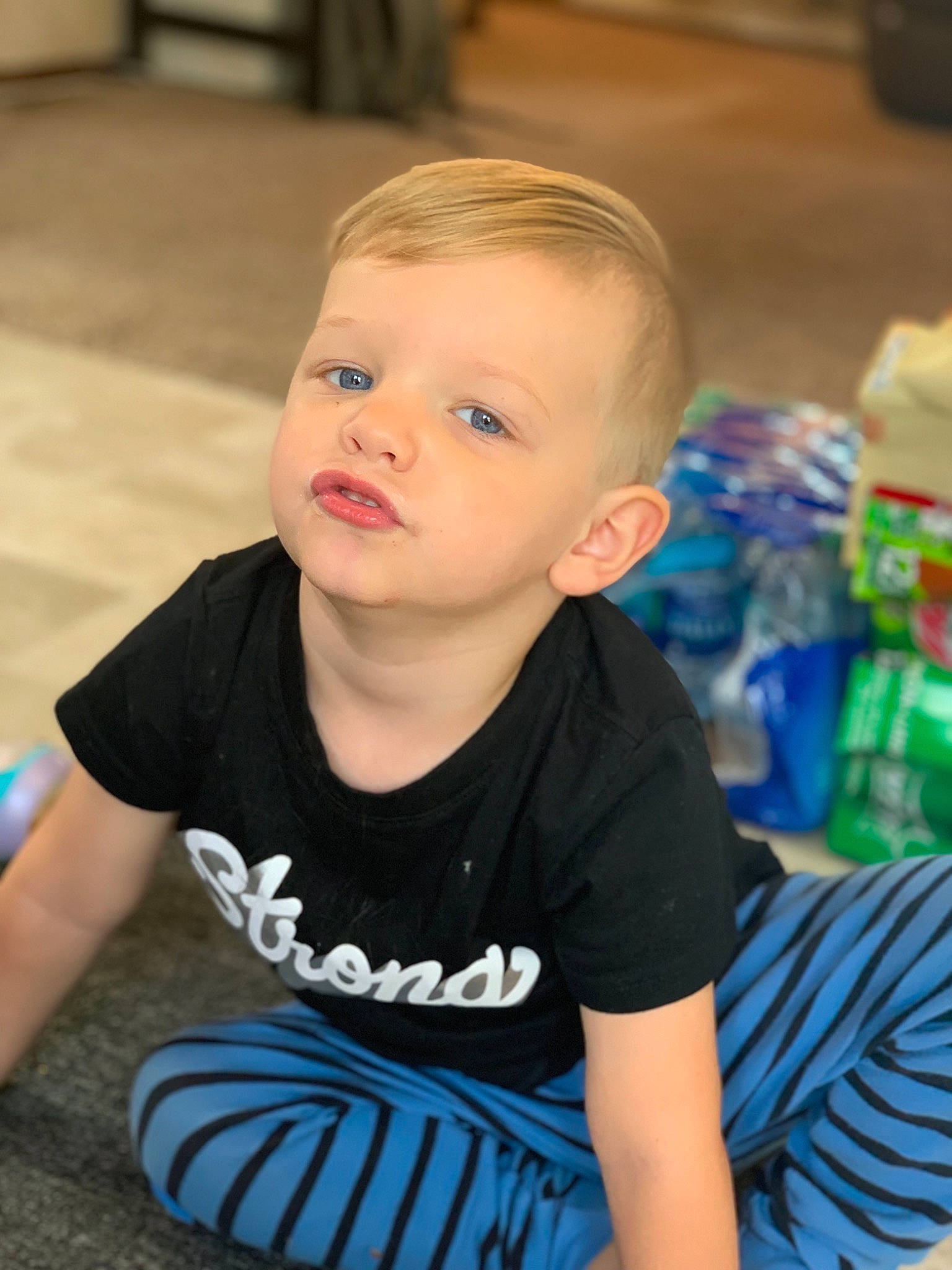 Jadon is registered to the contest to win money with this photo: baby, blue, cheek, child, chin, ear, eye, face, head, iris, male, person, play, sitting, skin, smile, t_shirt, toddler, vacation