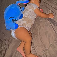 Angel is registered to the contest to win money with this photo: baby, sleeping, plush_toy, blue, bed, blanket, infant, child, cute, cozy, soft, pajamas, indoors, lying_down, peaceful, resting, toddler, stuffed_animal, comfort, nap