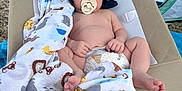 Liam joined the competition — help win amazing prizes! animal_print, baby, baby_chair, barefoot, beach, blanket, child, comfort, cute, diaper, hat, infant, outdoor, pacifier, relaxing, resting, sleeping, summer, sun_hat, tent