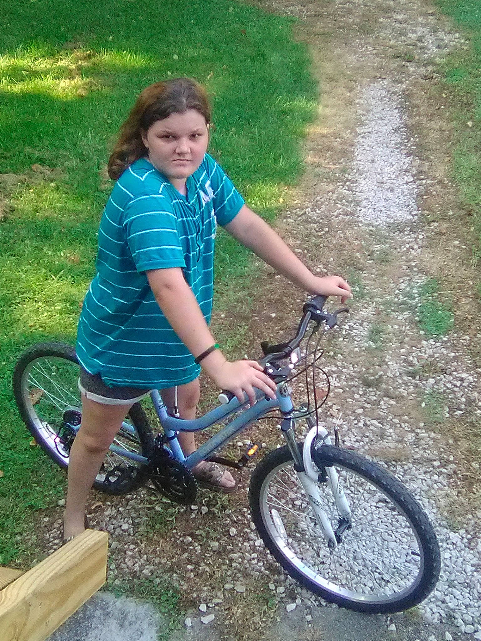 Tiffani is registered to the contest to win money with this photo: bicycle, bicycle_accessory, bicycle_frame, bicycle_handlebar, bicycle_saddle, bicycle_tire, bicycle_wheel, cycling, grass, mountain_bike, person, recreation, road_bicycle, soil, sports_equipment, tire, vehicle, wheel