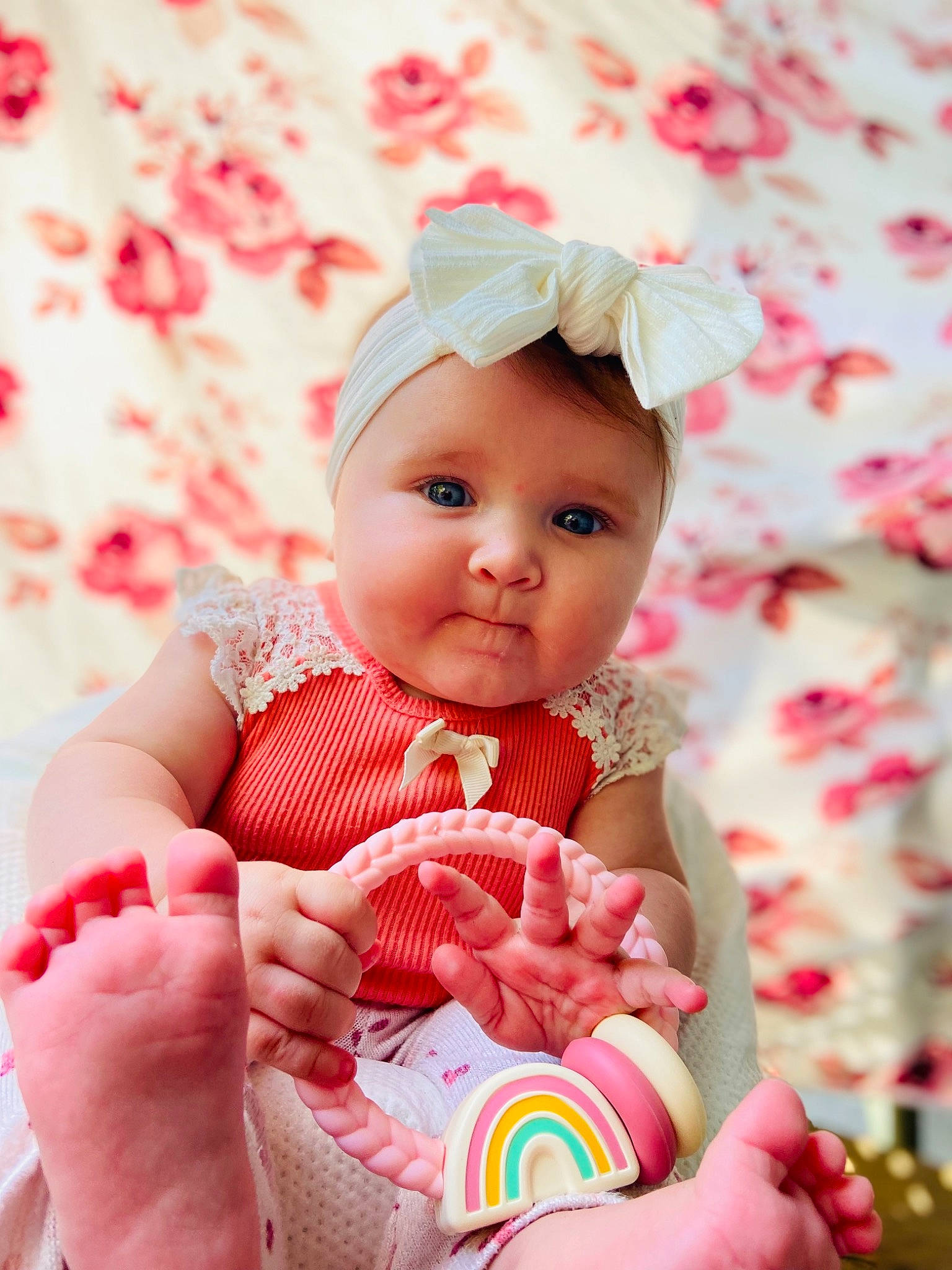 Ella Mae is registered to the contest to win money with this photo: baby, baby_products, baby_toddler_clothing, cheek, child, face, grass, hand, happy, head, headgear, headwear, lip, nail, pattern, person, pink, red, skin, sleeve