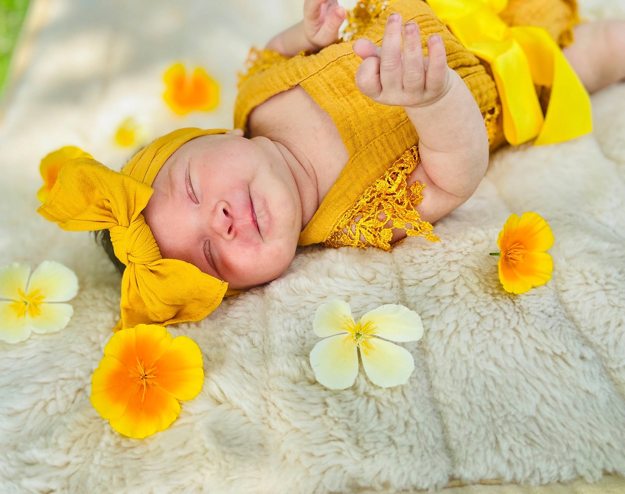 Ella Mae is registered to the contest to win money with this photo: baby, baby_sleeping, baby_toddler_clothing, child, comfort, finger, flower, happy, headgear, headwear, linens, orange, people, people_in_nature, person, petal, photograph, skin, textile, toddler