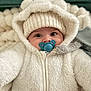 baby, infant, pacifier, hoodie, knit_hat, white, fluffy, cute, face, eyes, cozy, warm_clothing, child, portrait, indoors, blanket, soft_texture, closeup, baby_clothes, adorable