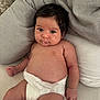 Giulia participe au concours pour gagner de l'argent avec cette photo : arm, baby, comfort, cushion, cute, diaper, drool, eyes, face, hair, hand, indoor, infant, leg, mouth, pillow, relaxed, sitting, skin, soft