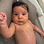 Giulia participe au concours pour gagner de l'argent avec cette photo : baby, bath, child, closeup, comfort, cushion, cute, expression, face, hand, indoors, infant, newborn, person, relaxing, resting, skin, water, wet_skin, young