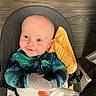 baby, child, infant, smile, blue_eyes, mittens, baby_seat, blanket, floor, wooden_floor, clothing, cute, comfort, indoor, portrait, happy, person, young_child, seat, playful