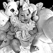 Lexy participe au concours pour gagner de l'argent avec cette photo : baby, infant, smiling, headband, bow, plush_toys, stuffed_animals, blanket, cute, child, portrait, happy, tutu, clothing, soft, indoors, baby_girl, sitting, closeup, monochrome