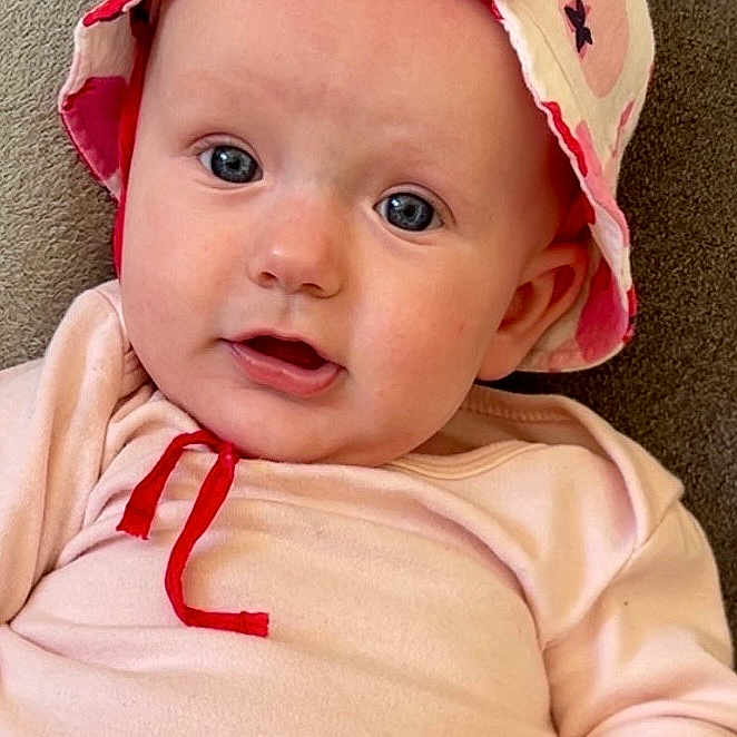 Julyana participe au concours pour gagner de l'argent avec cette photo : baby, bonnet, cap, clothing, coat, costume, couch, cushion, dress, face, furniture, hat, head, homedecor, newborn, person, photography, portrait, sitting, t_shirt