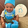 Josiah joined the competition — help win amazing prizes! baby, blue_bib, blue_hat, blue_toy, child, clothing, couch, cute, decor, easter_sign, handmade_sign, happy, holiday, indoor, infant, plush_toy, portrait, sitting, smiling, toy