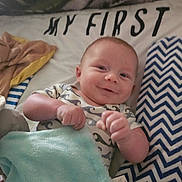 Mark joined the competition — help win amazing prizes! baby, bed, blanket, blue, child, comfort, cozy, cute, fabric, happy, indoors, infant, lying_down, onesie, pattern, person, pillow, relaxing, smiling, soft
