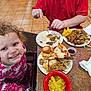 candid, casual, child, dining, dumplings, family, food, fork, happy, highchair, indoor, meal, noodles, pizza, plate, red_shirt, smile, table, tile_floor, toddler