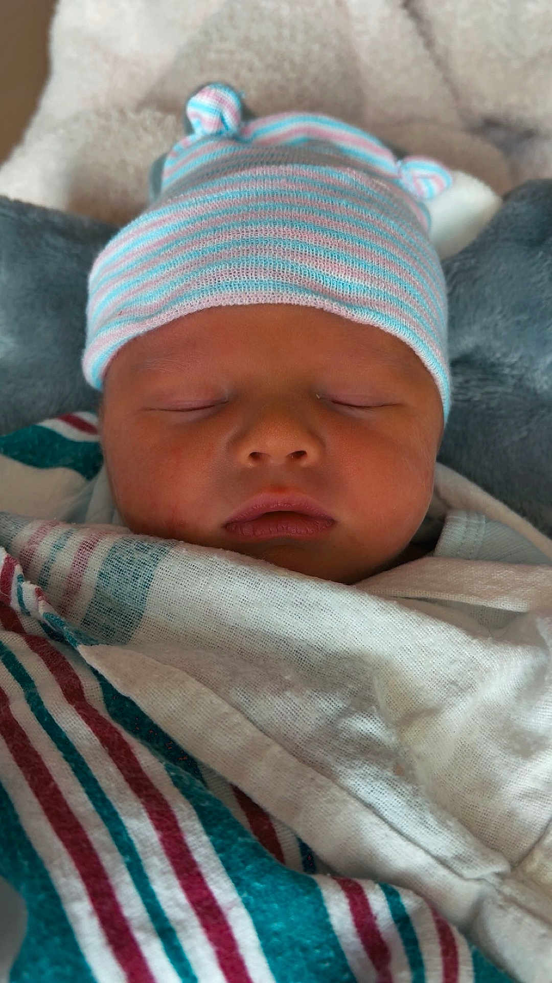 Van is registered to the contest to win money with this photo: baby, baby_clothes, blanket, child, closeup, cute, face, hat, indoors, infant, newborn, newborn_baby, peaceful, portrait, rest, sleep, sleeping, soft, striped_hat, swaddle