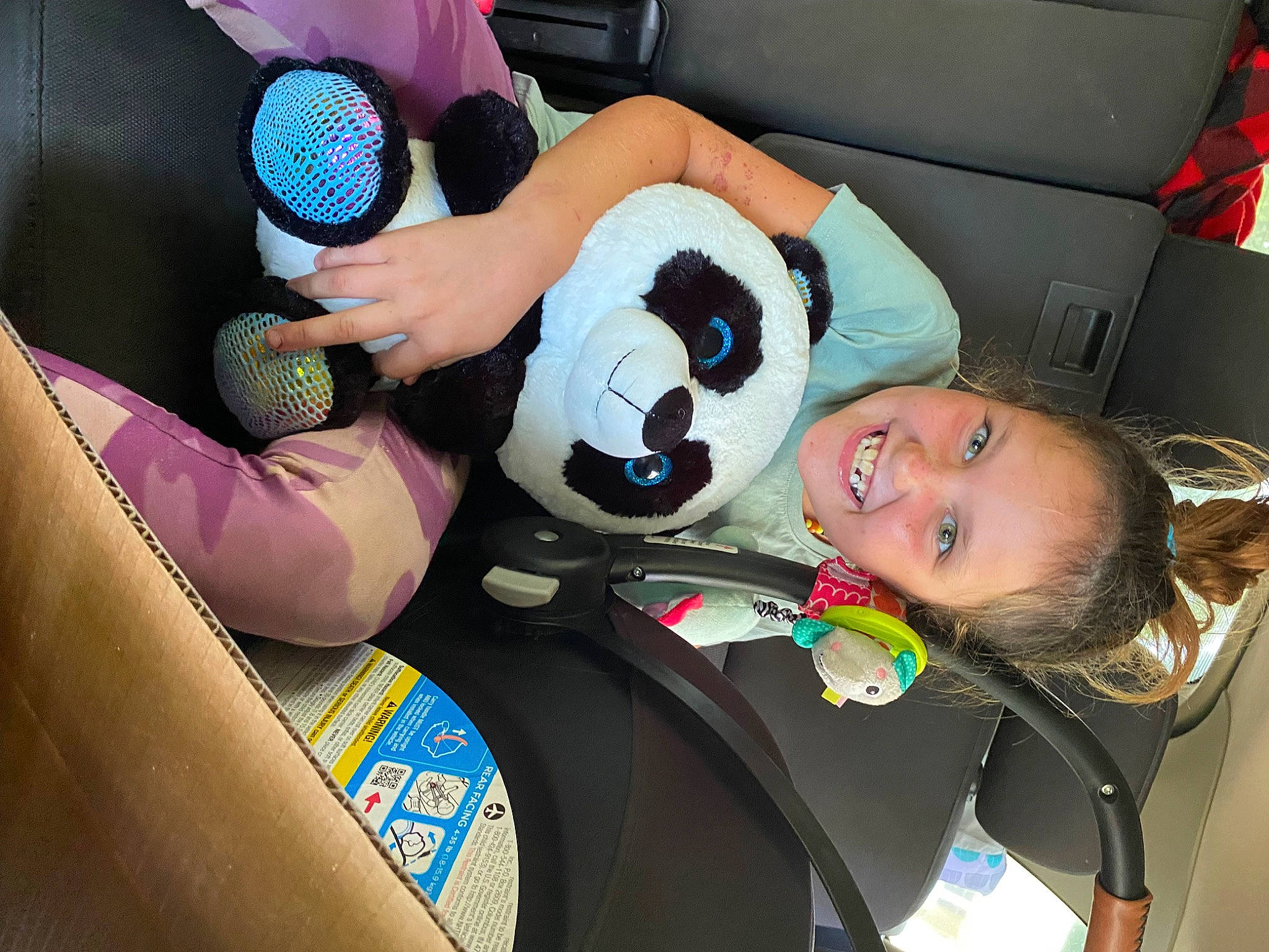 Anna is registered to the contest to win money with this photo: auto_part, automotive_design, automotive_exterior, car_seat, car_seat_cover, child, family_car, fun, joy, leisure, microphone, motor_vehicle, person, plush, recreation, smile, steering_wheel, stuffed_toy, toddler, toy