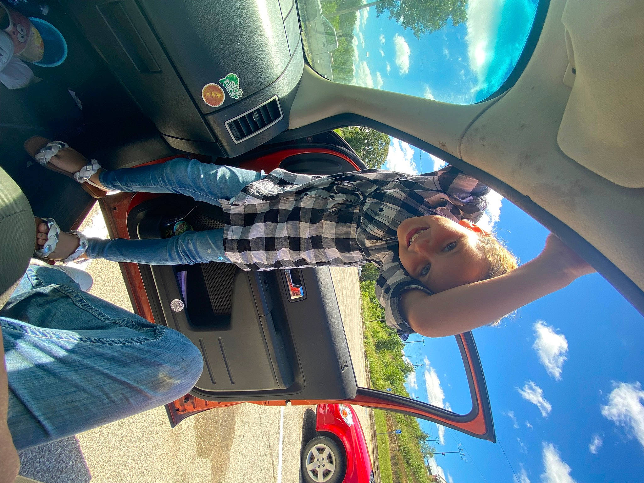 Anna is registered to the contest to win money with this photo: auto_part, automotive_design, automotive_exterior, automotive_lighting, automotive_mirror, automotive_tire, bumper, car, fender, headwear, hood, joy, light, motor_vehicle, person, sky, snapshot, tire, travel, vehicle