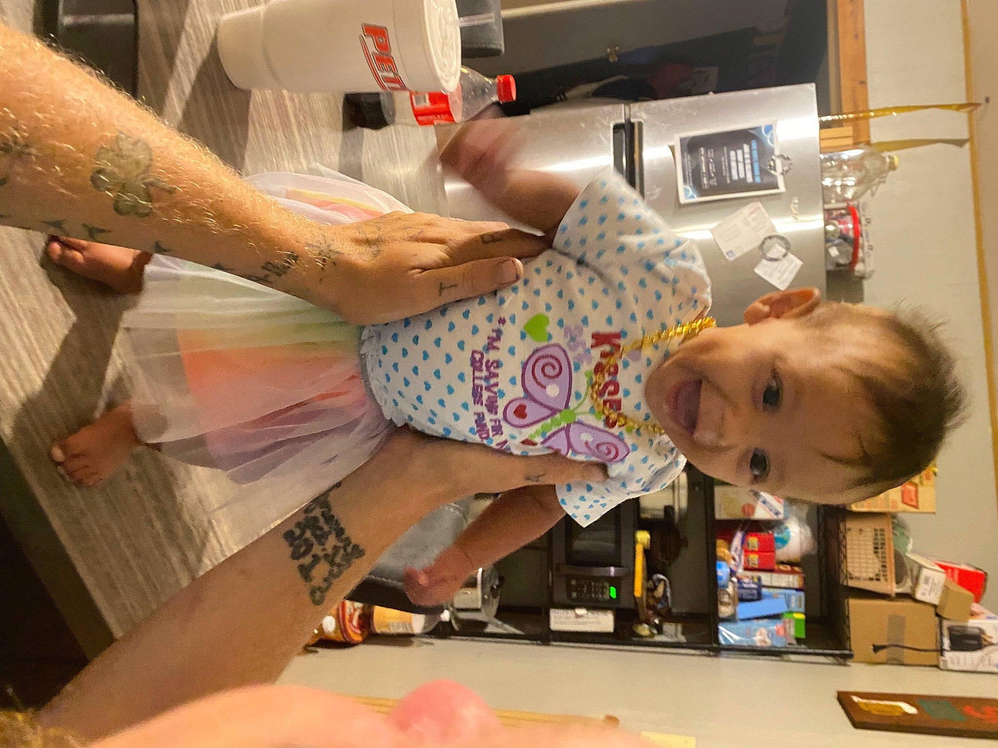River is registered to the contest to win money with this photo: baby, child, cooking, dress, event, finger, fun, homemaker, human_leg, kitchen, kitchen_appliance, machine, nail, person, play, refrigerator, room, service, thumb, toddler