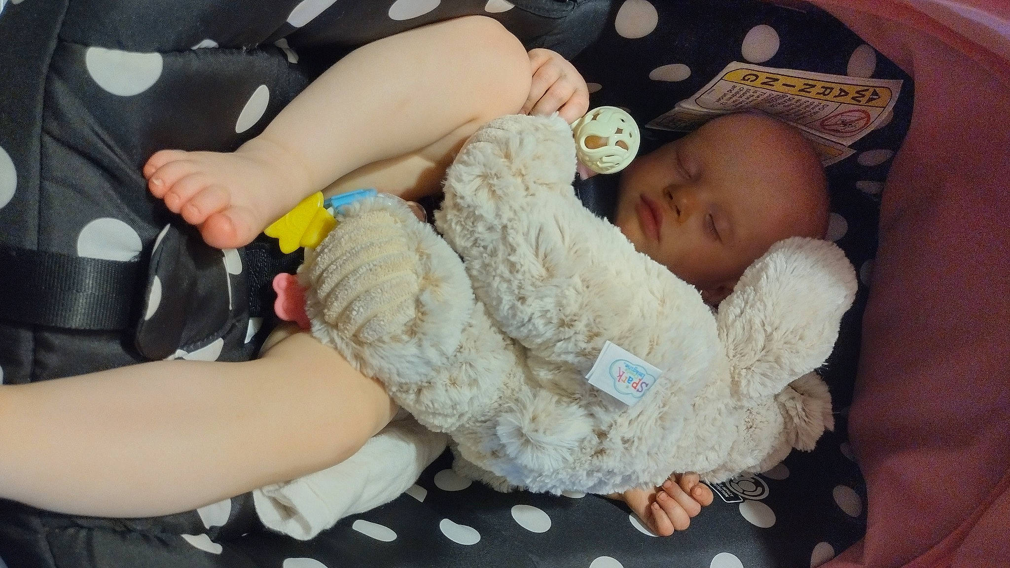 Shiloh is registered to the contest to win money with this photo: abdomen, baby, baby_sleeping, baby_toddler_clothing, bedtime, child, comfort, elbow, finger, human_leg, linens, nail, pattern, person, skin, textile, thigh, thumb, toddler, toy