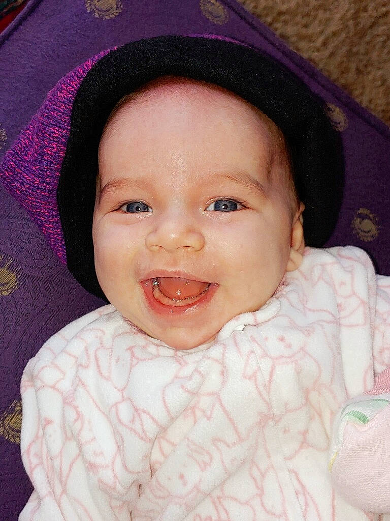 Adilynn is registered to the contest to win money with this photo: baby, beauty, cheek, child, chin, close_up, eye, eyebrow, face, facial_expression, forehead, head, headwear, iris, lip, mouth, nose, person, pink, skin