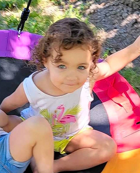 Juliet is registered to the contest to win money with this photo: child, fun, grass, hairstyle, happy, human_leg, joy, leg, leisure, magenta, nature, people_in_nature, person, pink, recreation, shorts, sitting, skin, summer, thigh