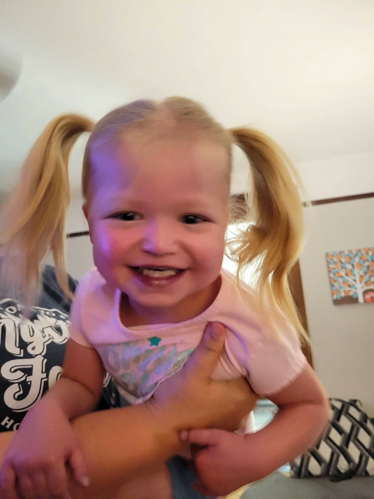 Kennedy is registered to the contest to win money with this photo: baby, baby_toddler_clothing, cheek, child, finger, fun, gesture, hair, hand, happy, head, iris, joy, lip, mammal, mouth, person, sitting, skin, smile