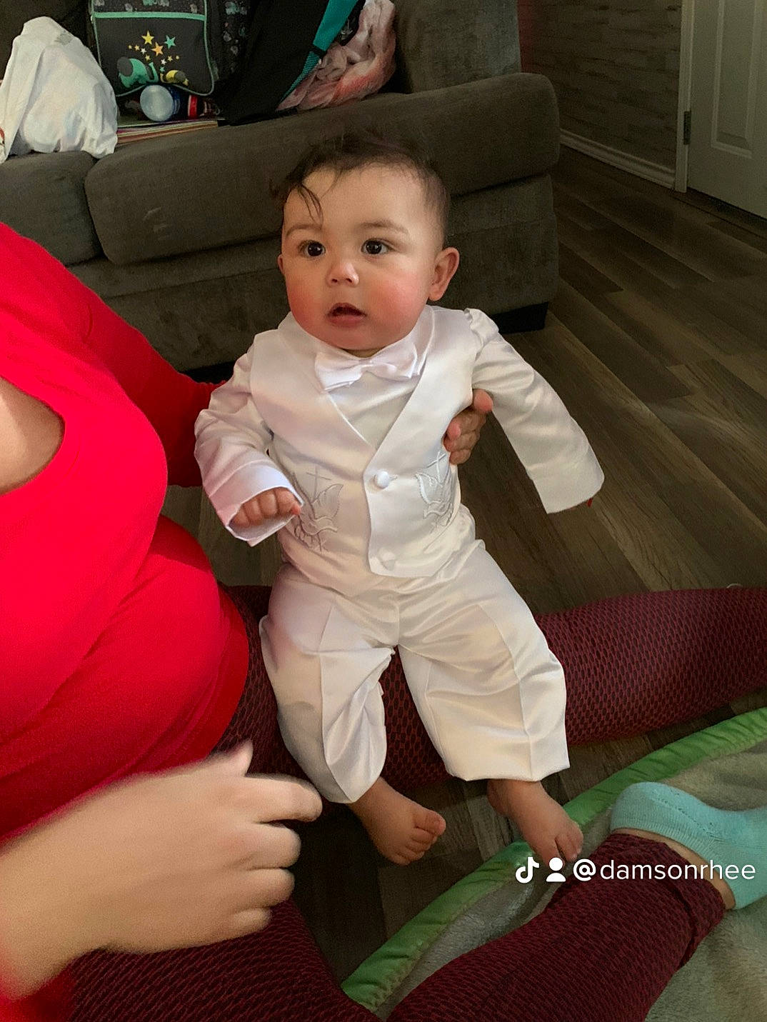 Aurelio is registered to the contest to win money with this photo: baby, baby_toddler_clothing, chair, cheek, comfort, couch, eye, flooring, foot, fun, furniture, happy, human_body, human_leg, lap, leg, person, skin, thigh, thumb