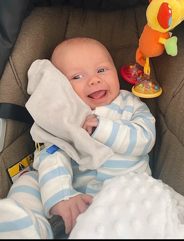 Harlan joined the competition — help win amazing prizes! baby, baby_products, baby_sleeping, baby_toddler_clothing, baby_toys, cheek, child, comfort, fun, happy, linens, pattern, person, room, sitting, smile, stuffed_toy, textile, thumb, toddler
