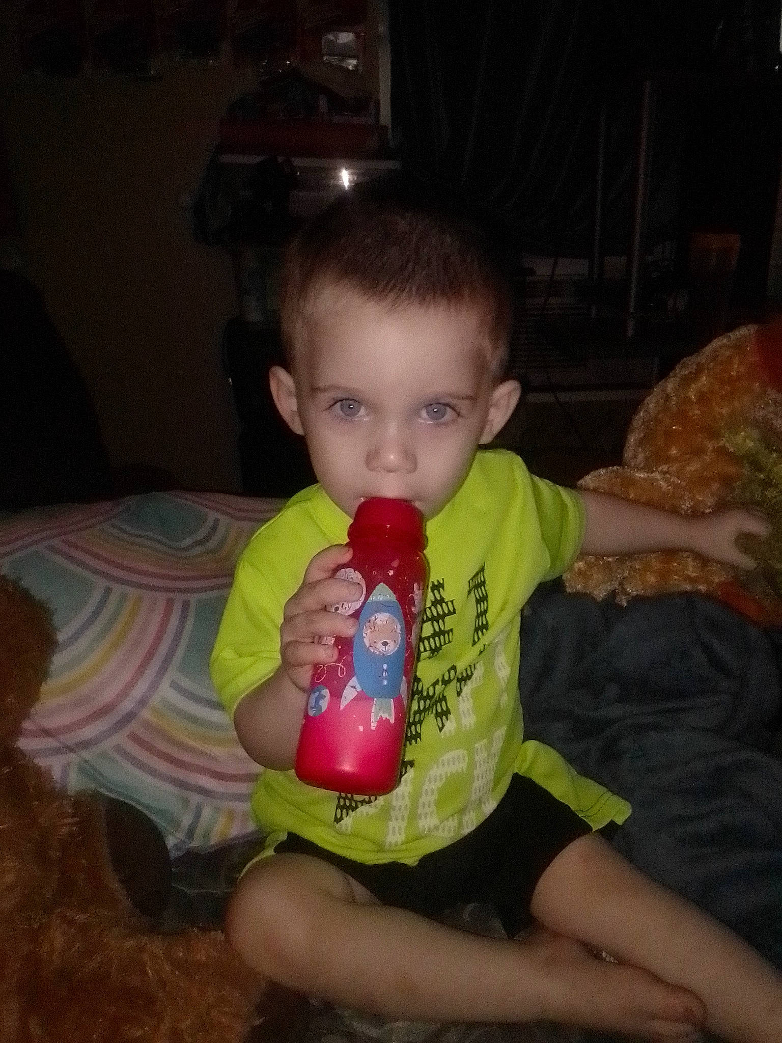 Justin is registered to the contest to win money with this photo: baby, baby_toddler_clothing, cheek, child, couch, drinkware, fun, happy, holiday, iris, lap, leg, nose, person, sitting, skin, standing, t_shirt, thigh, thumb