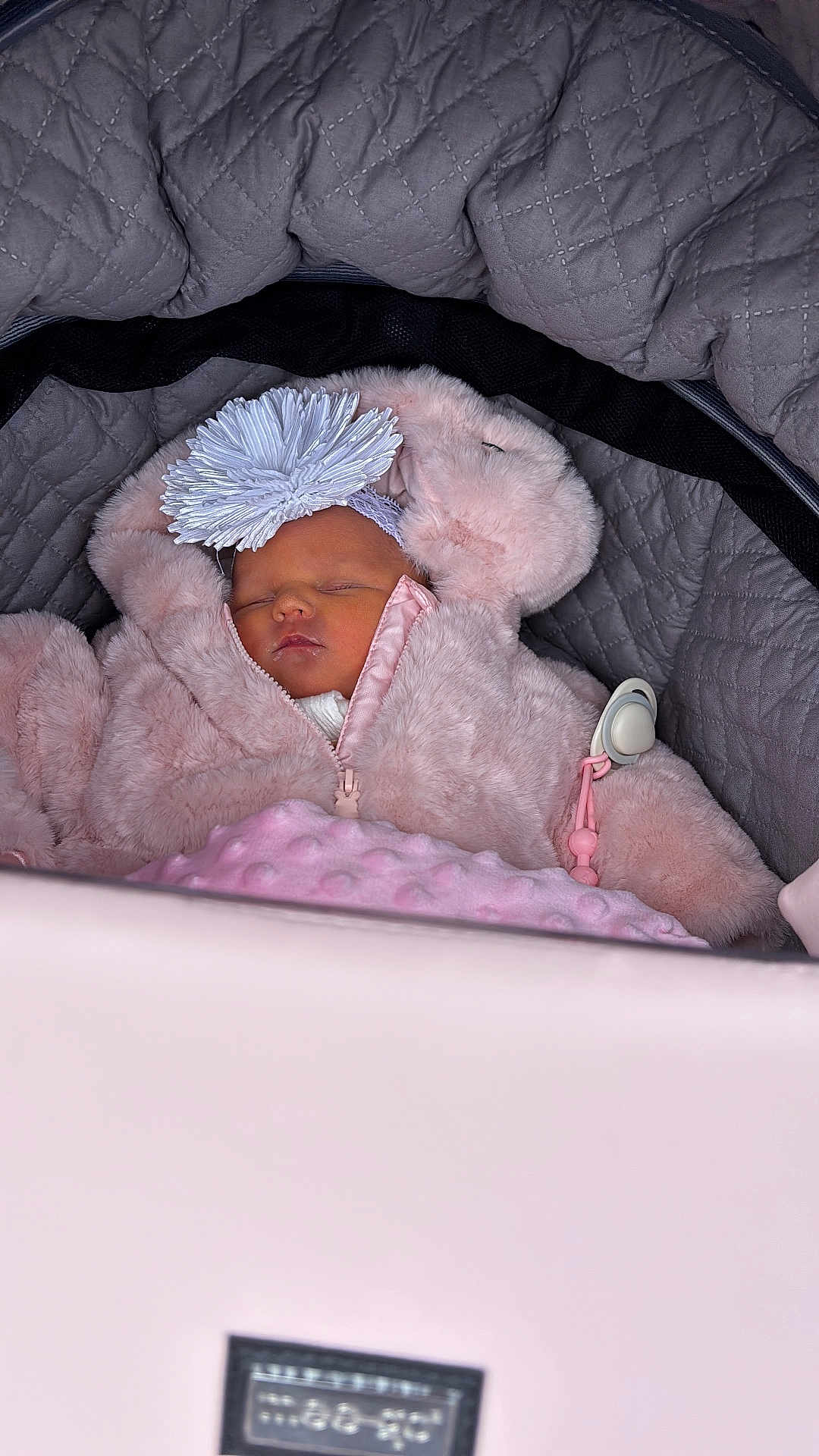 Arabella joined the competition — help win amazing prizes! baby, sleeping, stroller, pink, coat, headband, flower, quilted, blanket, cute, infant, face, peaceful, child, warm, clothing, portrait, closeup, soft, indoor